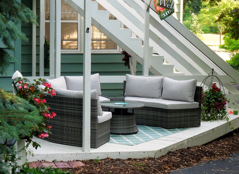 Relaxing and unwinding is easy with two back decks, a double water feature, and plenty of cushy seating