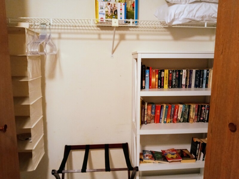 Closets are spacious and this one is filled with books.